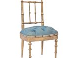 an image of a wooden chair with a blue cushion on top of it