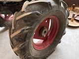 a tractor that is sitting on the floor in the garage