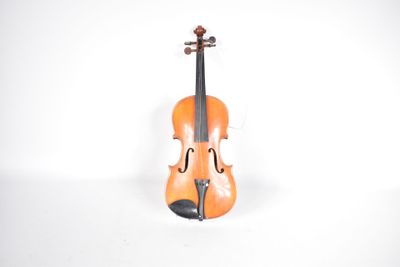 a violin that is sitting on a white surface