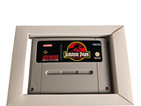 an image of a nintendo game console with a jurassic park sticker on it