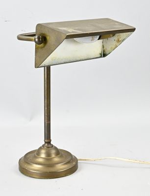 an image of a desk lamp on a white surface with a cord