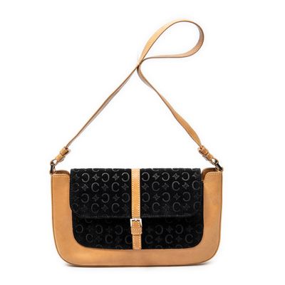 a black and tan handbag with a strap