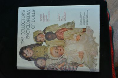 a book with a picture of a group of dolls on it
