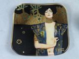 a plate with a picture of a woman on it