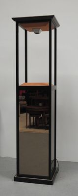 a black and wooden display case with a mirror on it