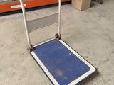a dolly that is sitting on the floor in a store