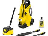 un gros plan sur un nettoyeur haute pression jaune et des produits d'entretien sur fond blanc