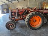 a tractor that is parked inside of a building