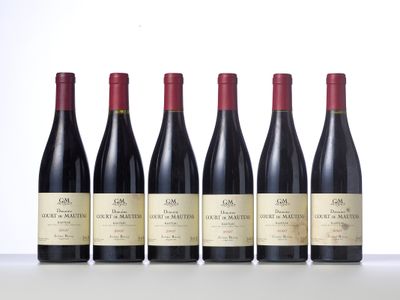 six bottles of red wine lined up in a row