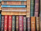 a box full of old books sitting on a table