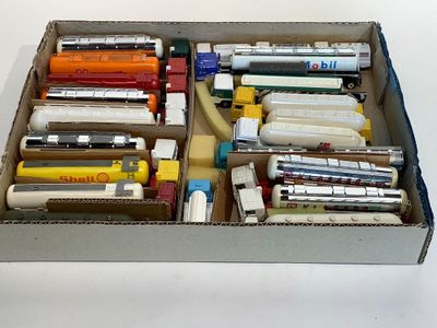a box full of pens and pencils sitting on a table