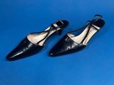 a pair of black shoes on a blue background