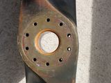 a close up of a piece of metal with holes in it