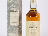 an open bottle of oban whisky next to a cardboard box