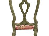 an image of a green chair with a pink cushion on top of it