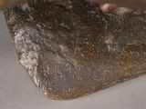 a rock with writing on it sitting on a table