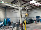 an image of a garage with a crane in the middle of it