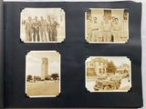 an old photo of a group of men standing in front of a clock tower