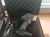a black case with tools inside of it on the floor