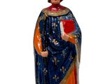 une figurine représentant un homme coiffé d'une couronne et tenant un livre