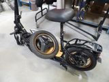 a scooter that is sitting on the floor in a garage