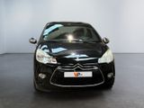 the front of a black citrole car parked in a showroom