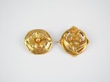 a pair of gold tone earrings with flowers and leaves