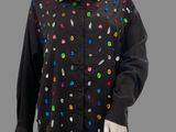 black button up shirt with multi - colored buttons on a mannequin head