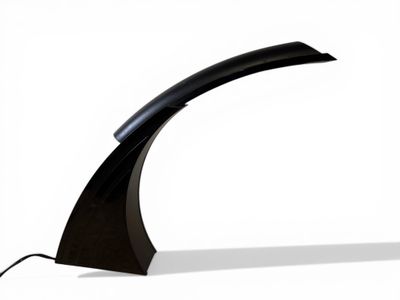 an image of a black curved lamp on a white background
