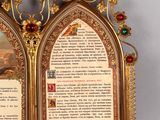 a gold frame with a picture of a man and a woman on it