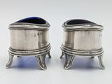 pair of silverplated salt and pepper shakers on stands
