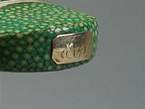 a green and gold case with a horse on it