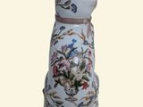 a cat figurine with a floral design on it