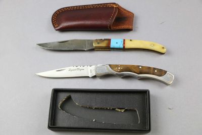 three different types of knives and a case on a table