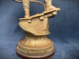 a statue of a man riding a horse on a sleigh