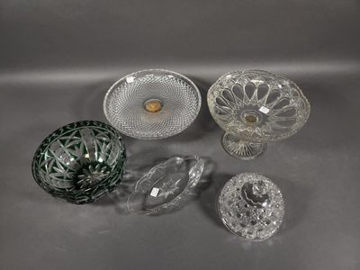 many different glass dishes and bowls on the table