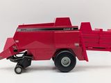 a red toy truck with a trailer attached to it