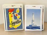 two boxes of cigarettes sitting on a table next to each other