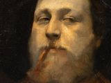 portrait of a bearded man with a pipe in his mouth