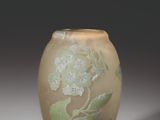 a small vase with a floral design on it