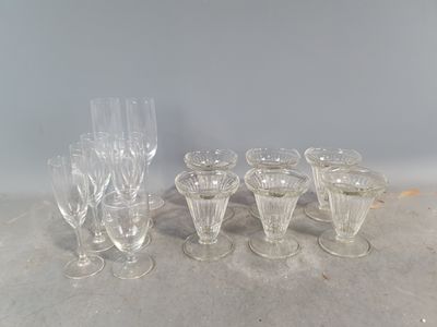 a lot of wine glasses sitting on a table