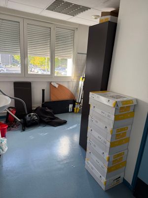 boxes stacked on top of each other in a room with a window