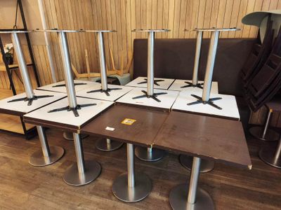 four chairs and a table in a room with wood flooring