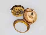 a gold ring with a picture of a man inside of it