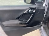 the interior of a car with the door open and the driver ' s seat up