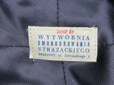 a close up of a label on a blue jacket