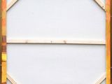 a close up of a wooden frame with paint on it