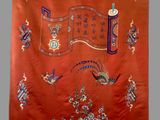 an image of a red cloth with oriental designs on it