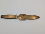 a close up of a knife on a table with a white background