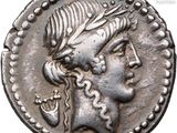 a silver coin with a woman ' s head on it